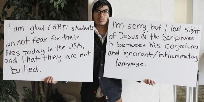 Student-holds-signs-in-cafeteria-660x330